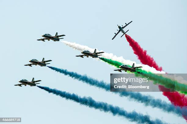 Alenia Aermacchi SpA MB-339 aircraft, operated by the United Arab Emirates Air Force's Al Fursan team, fly in formation during an aerial display at...