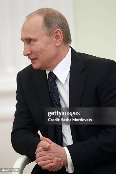 Russian President Vladimir Putin attends a meeting with President of South Ossetia Leonid Tibilov on March 18, 2015 in Moscow, Russia. A Lower House...