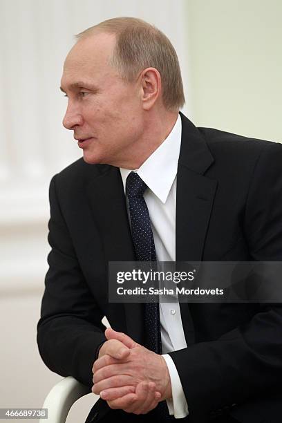 Russian President Vladimir Putin attends a meeting with President of South Ossetia Leonid Tibilov on March 18, 2015 in Moscow, Russia. A Lower House...