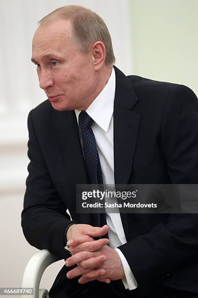 Russian President Vladimir Putin attends a meeting with President of South Ossetia Leonid Tibilov on March 18, 2015 in Moscow, Russia. A Lower House...