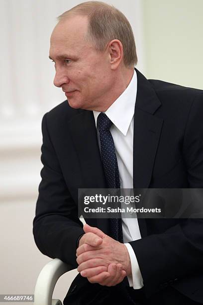 Russian President Vladimir Putin attends a meeting with President of South Ossetia Leonid Tibilov on March 18, 2015 in Moscow, Russia. A Lower House...