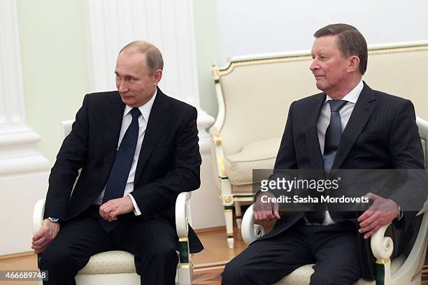 Russian President Vladimir Putin and his Chief of Staff Sergei Ivanov attend a meeting with President of South Ossetia Leonid Tibilov on March 18,...