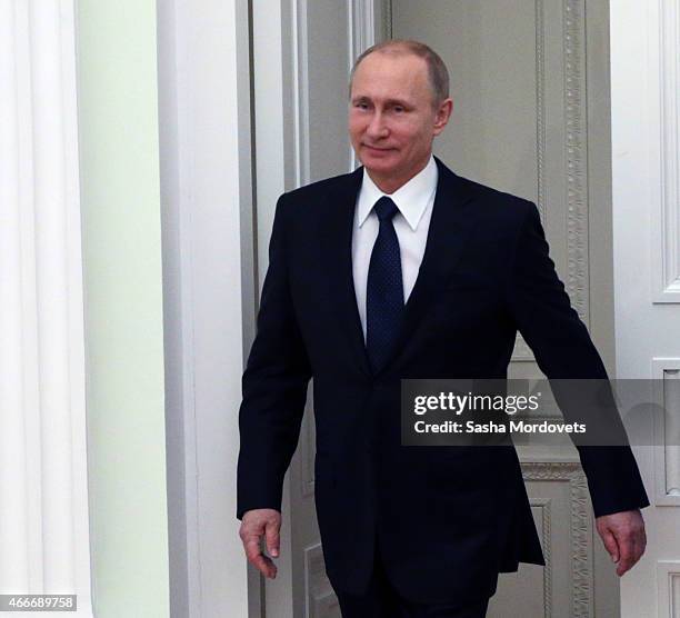 Russian President Vladimir Putin attends a meeting with President of South Ossetia Leonid Tibilov on March 18, 2015 in Moscow, Russia. A Lower House...