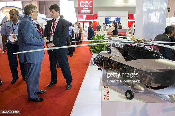 Model of a Mi-171A2 multirole helicopter, produced by at the Russian Helicopters JSC, stands on display at the company's booth during the Langkawi...