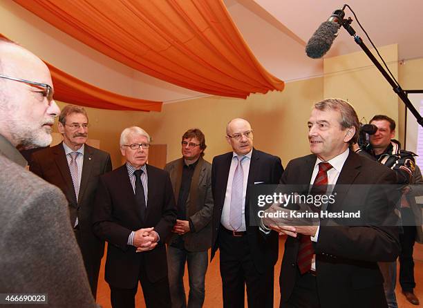 President Wolfgang Niersbach talks to the people in authority of Sermuth during a media event as the DFB and League Council hand over donations to...