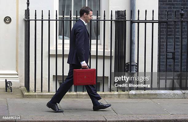 George Osborne, U.K. Chancellor of the exchequer, holds the dispatch box containing the 2015 budget as he leaves 11 Downing Street in London, U.K.,...