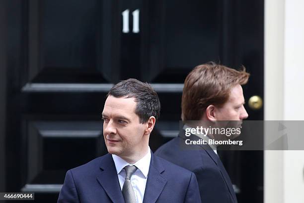 Danny Alexander, U.K. Chief secretary to the treasury, right, walks past George Osborne, U.K. Chancellor of the exchequer, outside 11 Downing Street...