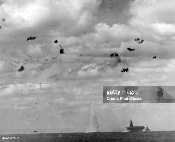 Japanese Zeke exploding near the USS Essex after being shot down by the USS Indianapolis, near Southern Honshu, Japan, March 19, 1945.