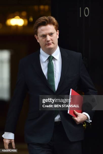 Britain's Chief Secretary to the Treasury Danny Alexander leaves 10 Downing Street in London, on March 18 as Finance Minister George Osborne prepares...