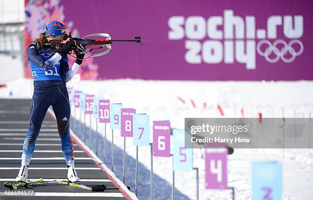 Susan Dunklee of United States shoots during a Biathlon training session ahead of the Sochi 2014 Winter Olympics at Laura Cross-Country Ski and...