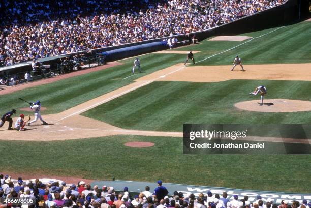 General view Sammy Sosa of the Chicago Cubs swings at a pitch during the game against the Montreal Expos on August 5, 1999 at Wrigley Field in...