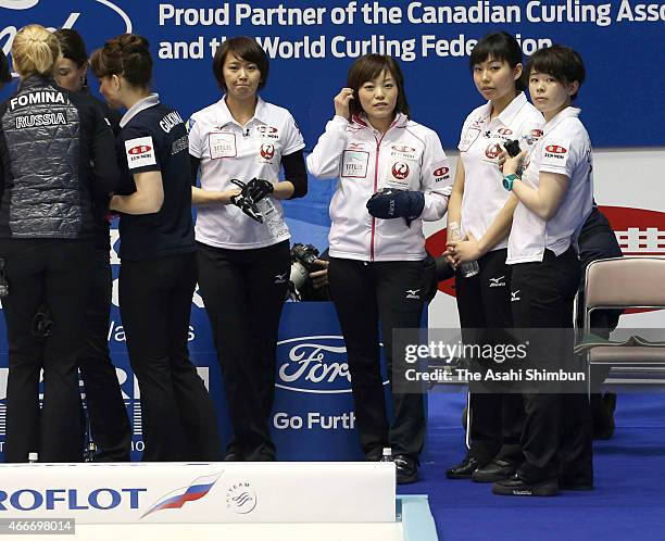 Sayaka Yoshimura, Ayumi Ogasawara, Anna Ohmiya and Kaho Onodera of Japan react during a round-robin match between Japan and Russia during day four of...