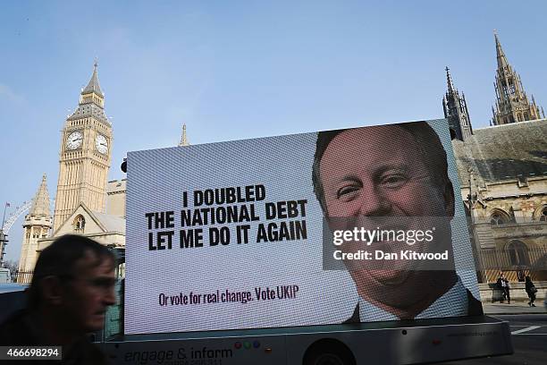 United Kingdom Independence Party political campaign poster is driven around Westminster on March 18, 2015 in London, England. The Chancellor George...