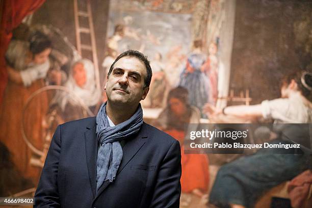 Gabriele Finaldi, deputy director for collections and research of Prado Museum poses for photographers next to Velazquez's painting 'The Spinners'...