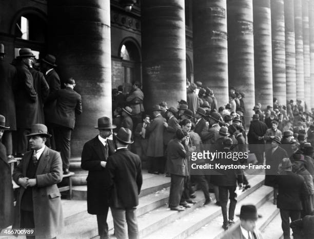 Excitement outside the Paris Stock Exchange after Prime Minister Raymond Poincare resigned in November 1928 in Paris, France.