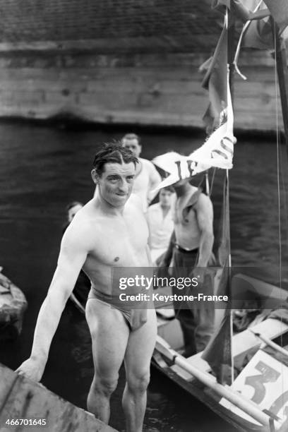 Mr Tallon, winner of the swimming contest in the Seine river on National Day, on July 14, 1929 in Paris, France.