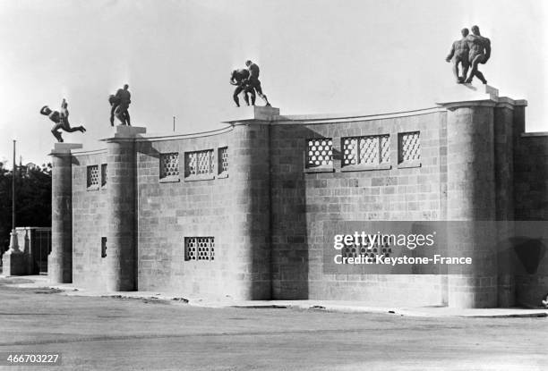 Main entrance of the new fascist stadium with statues symbolizing all sports in September 1929 in Rome, Italy.