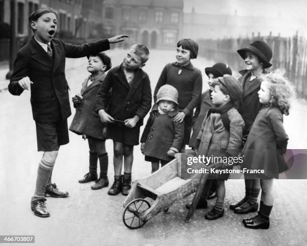 Leslie Wilson schoolboy with golden voice, sings for his admirers, circa 1930 in United Kingdom.