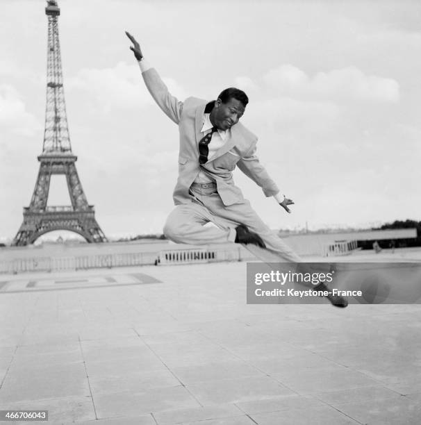Boxer Sugar Ray Robinson dancing on the Esplanade du Trocadero, in 1954 in Paris, France.