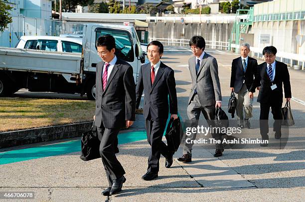 Land, Infrastructure, Transport and Tourism ministry officials arrive at the Toyo Tire & Rubber Akashi factory to investigate on March 17, 2015 in...