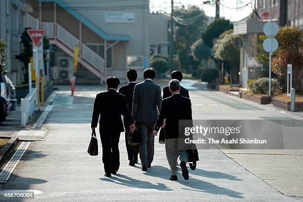 Land, Infrastructure, Transport and Tourism ministry officials arrive at the Toyo Tire & Rubber Akashi factory to investigate on March 17, 2015 in...