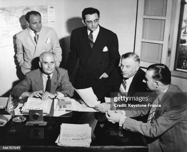 United Nations Commissioner for Libya, Doctor Adriaan Pelt , above left, discusses plans with United Nations officials, circa 1951. His task: to...