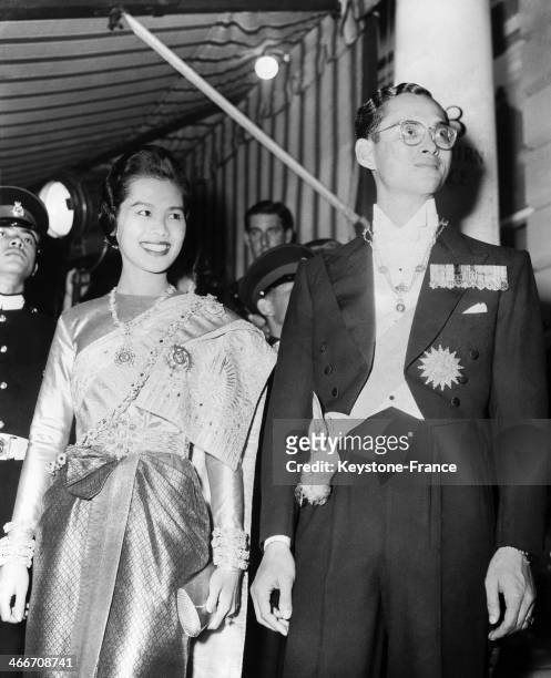 King Bhumibol Adulyadej of Thailand, aka Rama IX and wife Queen Sirikit Kitiyakara arrive at the Thai embassy at Ashburn place in London, United...