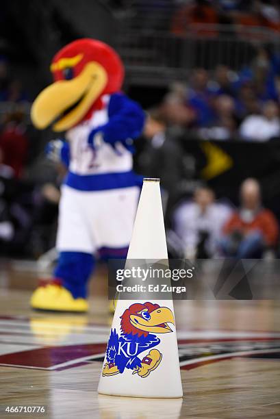 Kansas Jayhawks logo appears on a cheerleaders cone during a game against the TCU Horned Frogs during the quarterfinal round of the Big 12 basketball...