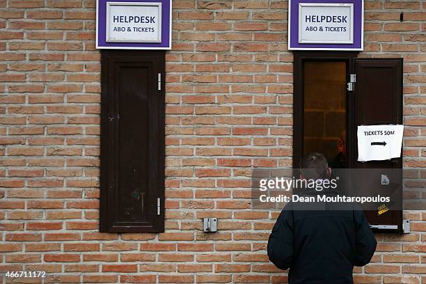 Fan speaks to a staff member at the help desk outside the stadium prior to the UEFA Youth League quarter final match between RSC Anderlecht and FC...