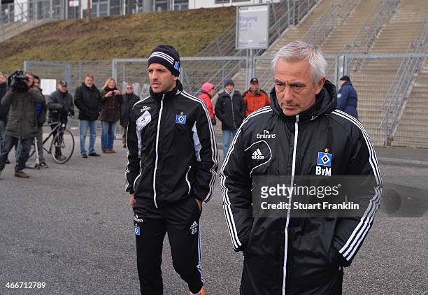 Team captain Rafael van der Vaart walks with Bert van Marwijk, head coach of Hamburg during the training session of Hamburger SV on February 3, 2014...