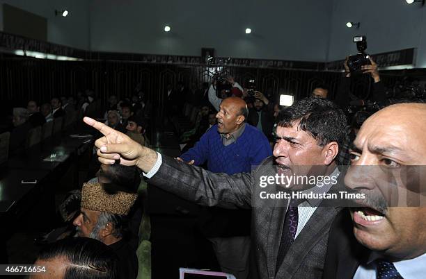 Opposition MLAs protesting during J&K Governor NN Vohra address on the first day of budget session of Jammu and Kashmir legislator assembly on March...