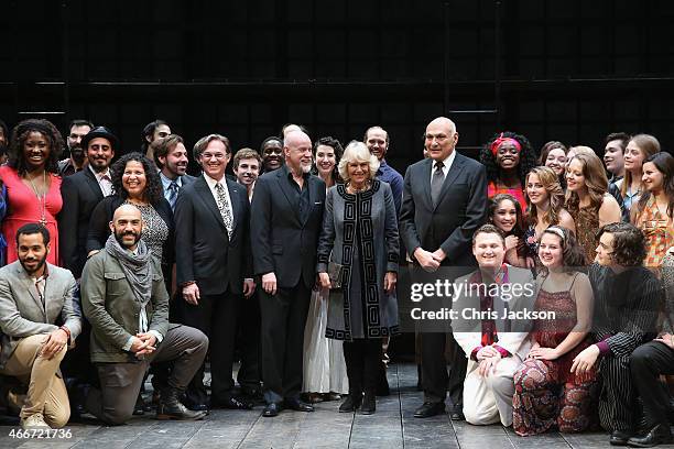 Camilla, Duchess of Cornwall visits poses with performers on stage as she visits the Shakespeare Theatre Company on the second day of a visit to the...