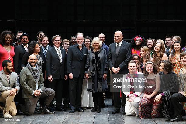 Camilla, Duchess of Cornwall visits poses with performers on stage as she visits the Shakespeare Theatre Company on the second day of a visit to the...