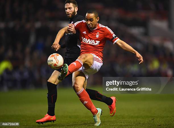 Dexter Blackstock of Nottingham Forest beats Kirk Broadfoot of Rotherham United to score their first goal during the Sky Bet Championship match...