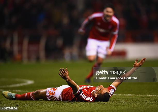 Dexter Blackstock of Nottingham Forest celebrates with Henri Lansbury as he scores their first goal during the Sky Bet Championship match between...