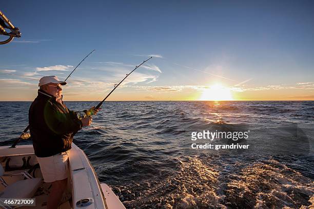 elderly man fishing - fiskeindustri bildbanksfoton och bilder