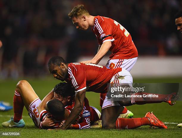 Dexter Blackstock of Nottingham Forest celebrates with team mates as he scores their first goal during the Sky Bet Championship match between...