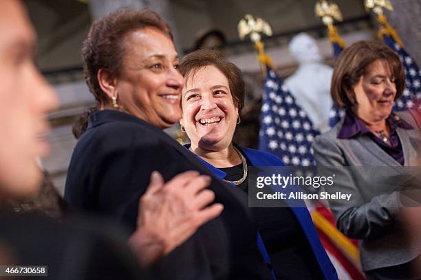 Supreme Court Justice Elena Kagan, C, socializes with CEO of AARP Jo Ann Jenkins and other attendees at an annual Women's History Month reception...