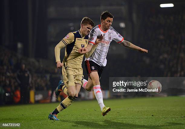Tim Hoogland of Fulham battles with Sam Byram of Leeds United during the Sky Bet Championship match between Fulham and Leeds United at Craven Cottage...