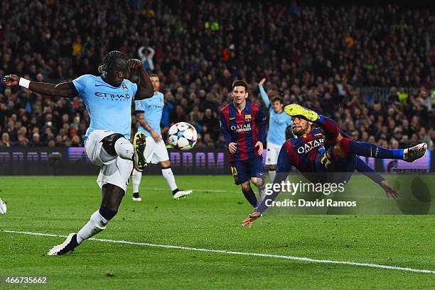 Neymar of Barcelona performs a scissor kick as he is closed down by Bacary Sagna of Manchester City during the UEFA Champions League Round of 16...