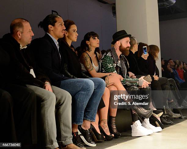 Footballer Bruno Alves, guest, Ivone Meireles and footballer Raul Meireles pose at the Hakan Akkaya show during Mercedes Benz Fashion Week Istanbul...