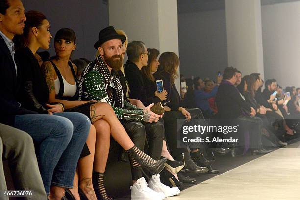 Footballer Bruno Alves, guest, Ivone Meireles and footballer Raul Meireles pose at the Hakan Akkaya show during Mercedes Benz Fashion Week Istanbul...