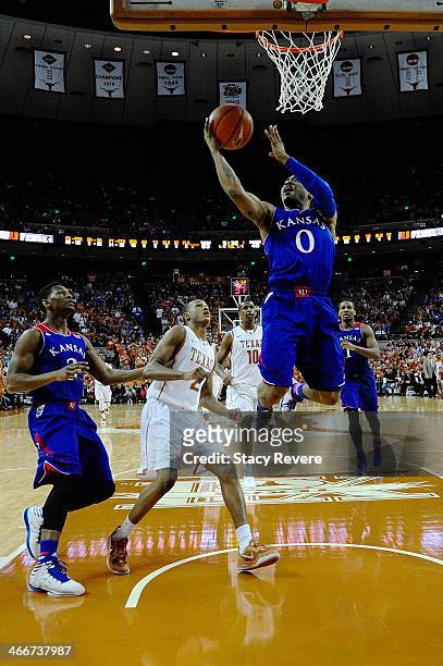 Frank Mason of the Kansas Jayhawks shoots in front of Demarcus Holland of the Texas Longhorns during a game at The Frank Erwin Center on February 1,...