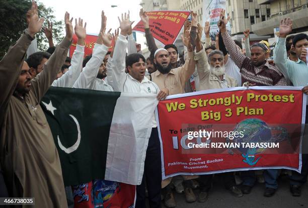 Pakistani cricket fans shout slogans during a protest against the International Cricket Council and its decision to restructure and hand power to...