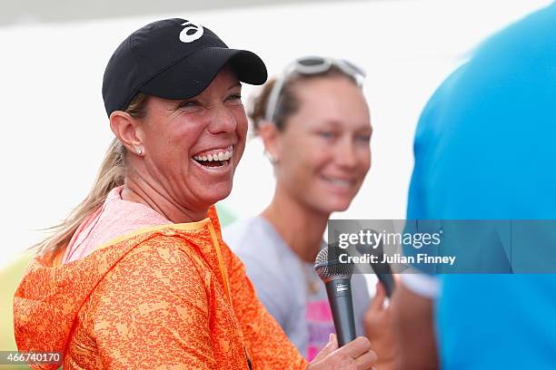 Lisa Raymond of USA and Sam Stosur of Australia talk to fans at the entertainment stand during day ten of the BNP Paribas Open tennis at the Indian...