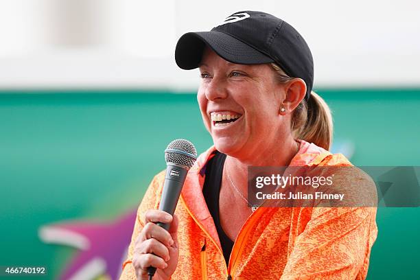 Lisa Raymond of USA talks to fans at the entertainment stand during day ten of the BNP Paribas Open tennis at the Indian Wells Tennis Garden on March...