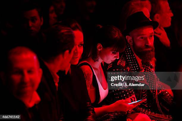 Footballer Bruno Alves, guest, Ivone Meireles and footballer Raul Meireles attend the Hakan Akkaya show during Mercedes Benz Fashion Week Istanbul...