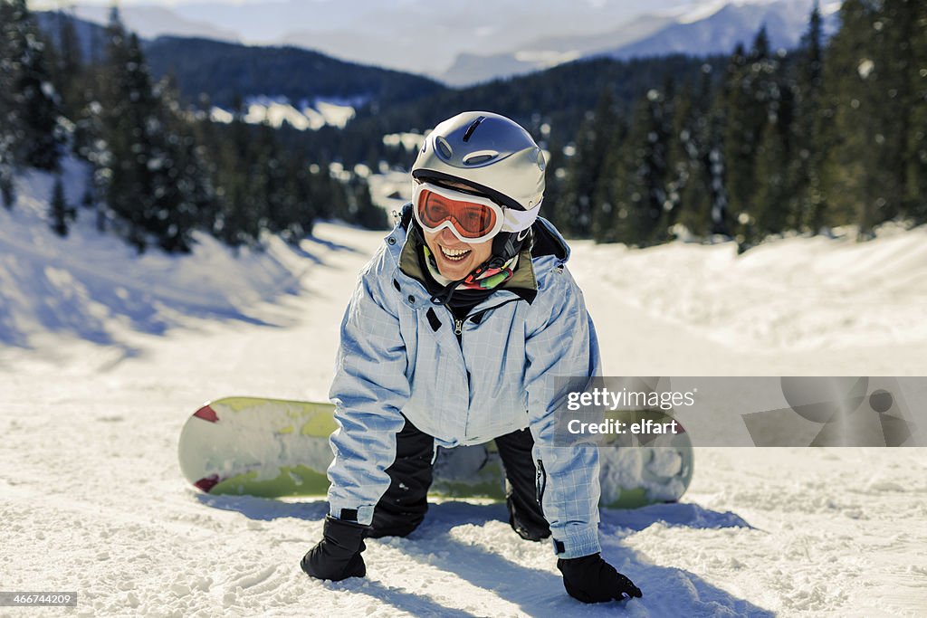 Female Snowboarder learning