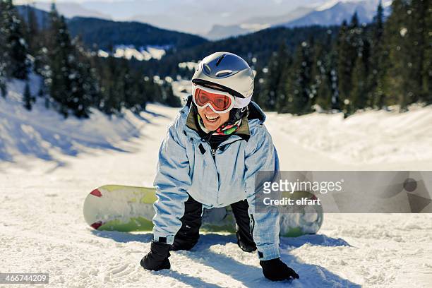 female snowboarder learning - woman snowboarding stock pictures, royalty-free photos & images