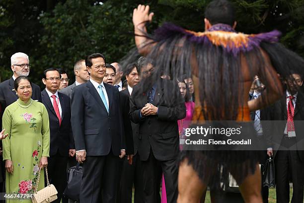 Vietnamese Prime Minister Nguyen Tan Dun and his wife Tran Thanh Kiem watch a traditional Maori welcome at Government House on March 19, 2015 in...